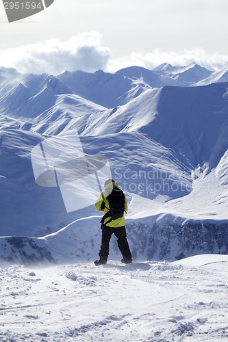 Image of Snowboarder on top of off-piste slope