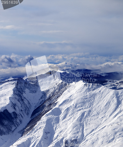 Image of Winter mountains in mist at windy winter day