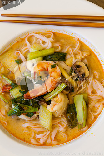 Image of Bowl of traditional Thai tom yam soup