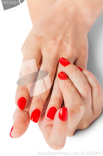 Image of Woman with beautiful manicured red fingernails