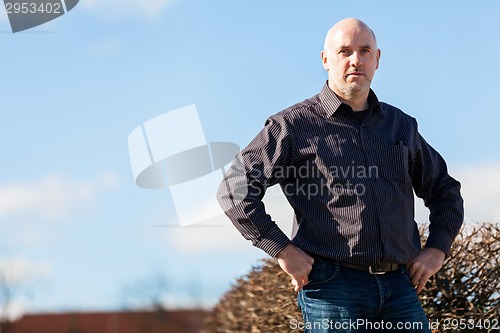 Image of Thoughtful man sitting on a flight of steps