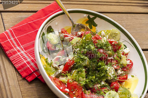 Image of Bowl of Marinated Greek Salad with Red Napkin