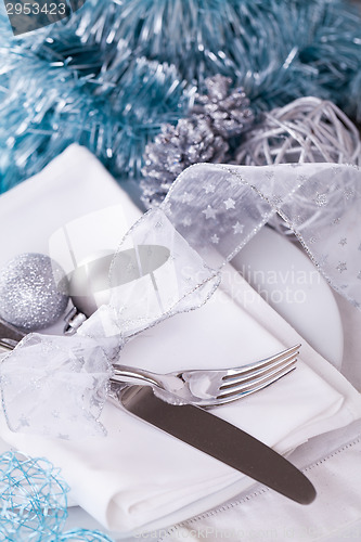 Image of Stylish blue and silver Christmas table setting