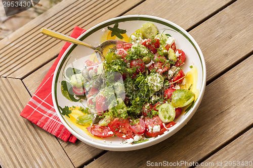 Image of Bowl of Marinated Greek Salad with Red Napkin