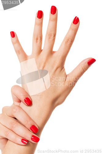 Image of Woman with beautiful manicured red fingernails