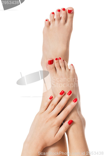 Image of Woman with beautiful red finger and toenails