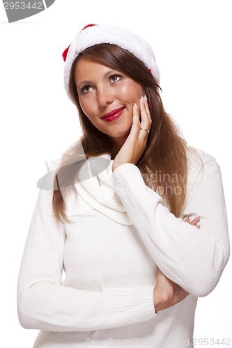 Image of Attractive woman wearing a festive red Santa hat