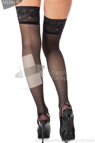 Image of Sexy female legs in stilettos and stockings