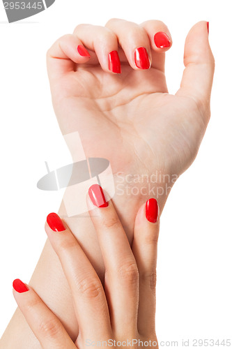 Image of Woman with beautiful manicured red fingernails