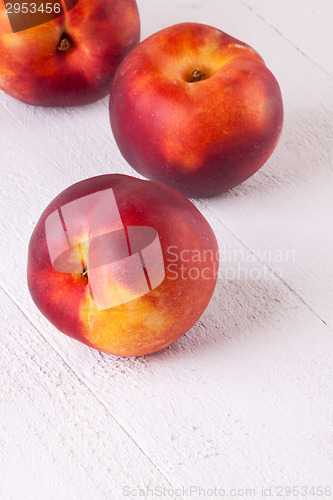 Image of Three tasty fresh ripe juicy nectarines