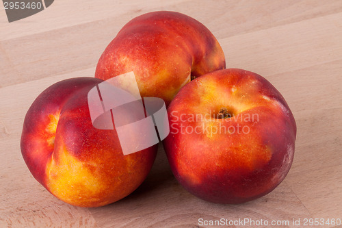 Image of Three tasty fresh ripe juicy nectarines