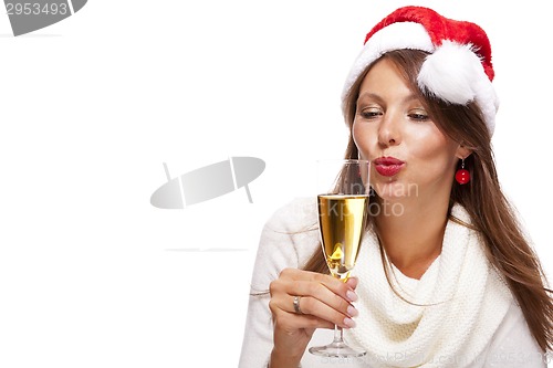 Image of Playful woman celebrating Xmas blowing a kiss