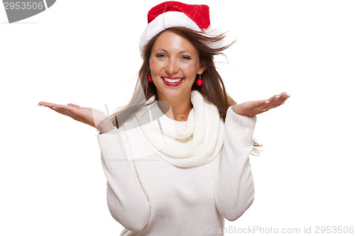 Image of Young woman in a Santa hat holding out her hands