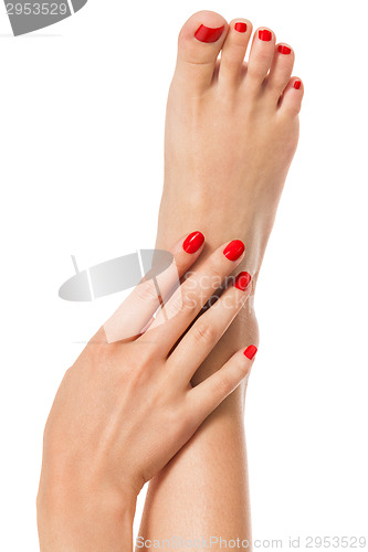 Image of Woman with beautiful red finger and toenails