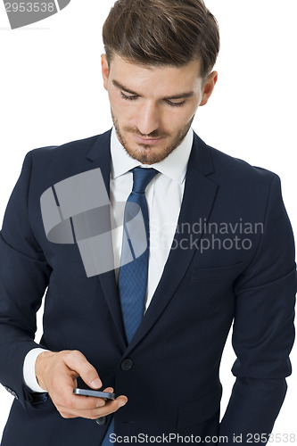 Image of Stylish businessman chatting on his mobile