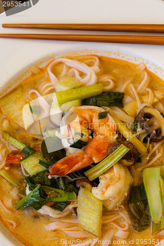 Image of Bowl of traditional Thai tom yam soup