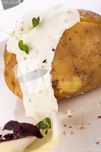 Image of Baked jacket potato with sour cream sauce