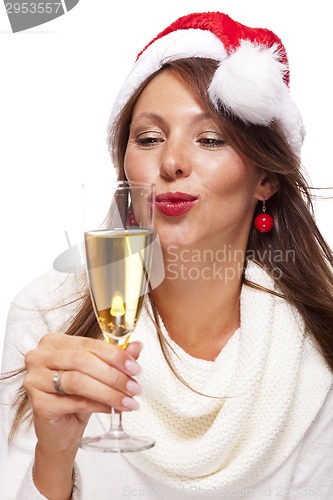 Image of Playful woman celebrating Xmas blowing a kiss