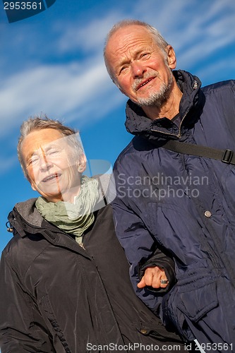 Image of happy mature couple relaxing baltic sea dunes 