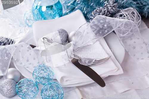 Image of Stylish blue and silver Christmas table setting