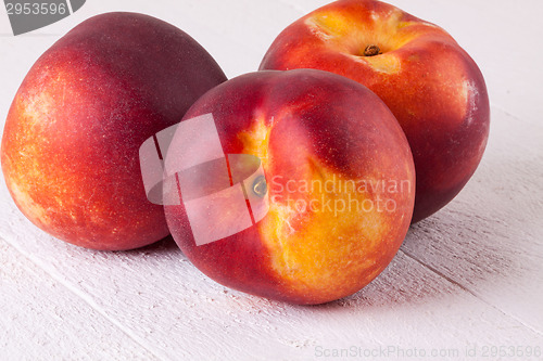 Image of Three tasty fresh ripe juicy nectarines