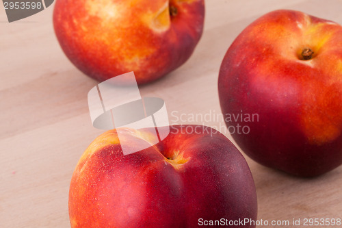 Image of Three tasty fresh ripe juicy nectarines