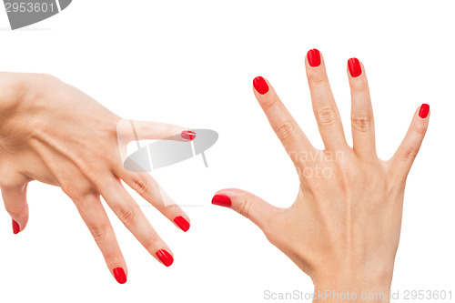 Image of Woman with beautiful manicured red fingernails