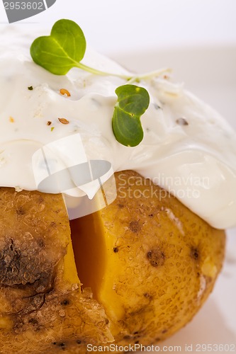 Image of Baked jacket potato with sour cream sauce