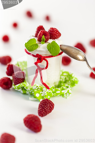 Image of Raspberries and yoghurt or clotted cream