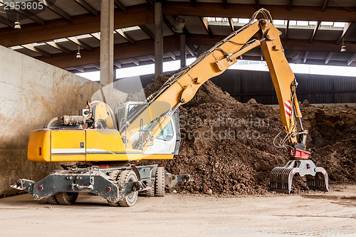 Image of Heavy duty excavator doing earth moving