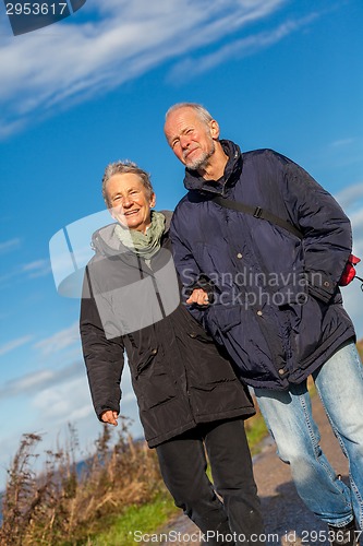 Image of happy mature couple relaxing baltic sea dunes 