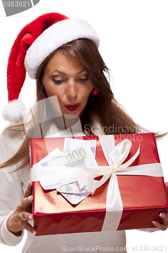 Image of Young woman with an Xmas gift and money