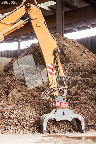Image of Heavy duty excavator doing earth moving