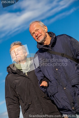 Image of happy mature couple relaxing baltic sea dunes 