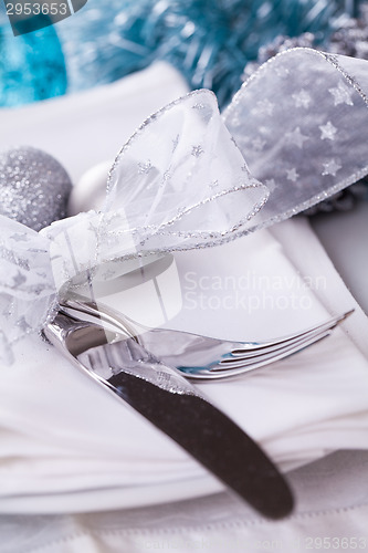 Image of Stylish blue and silver Christmas table setting