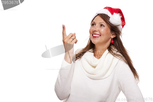 Image of Young woman in a Santa hat holding out her hands