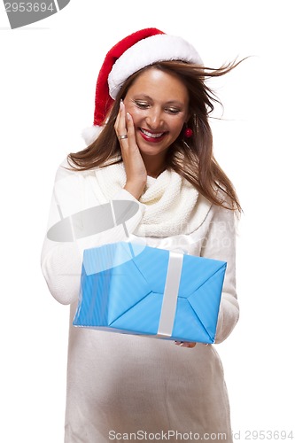 Image of Beautiful vivacious woman with a Christmas gift