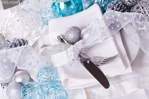 Image of Stylish blue and silver Christmas table setting