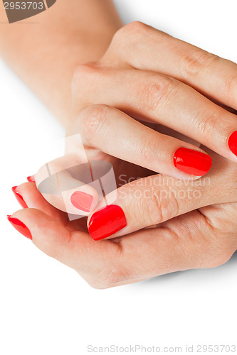 Image of Woman with beautiful manicured red fingernails