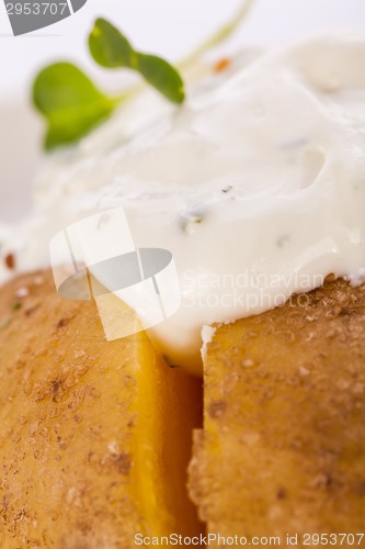 Image of Baked jacket potato with sour cream sauce