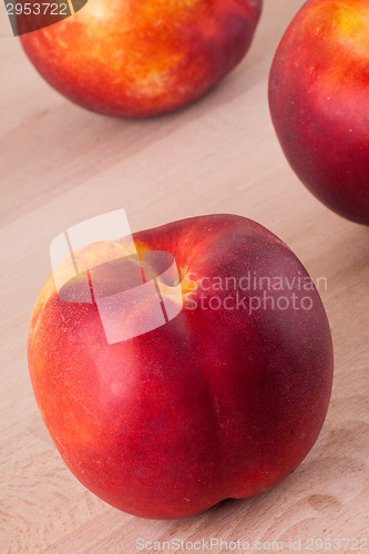 Image of Three tasty fresh ripe juicy nectarines