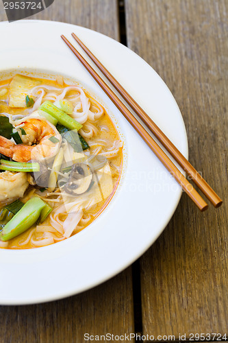 Image of Bowl of traditional Thai tom yam soup