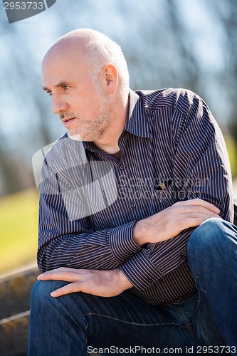 Image of Thoughtful man sitting on a flight of steps