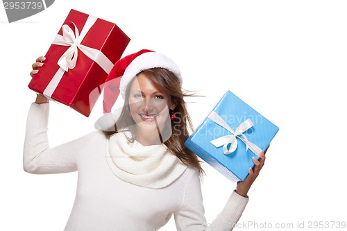 Image of Vivacious woman in a Santa hat celebrating Xmas