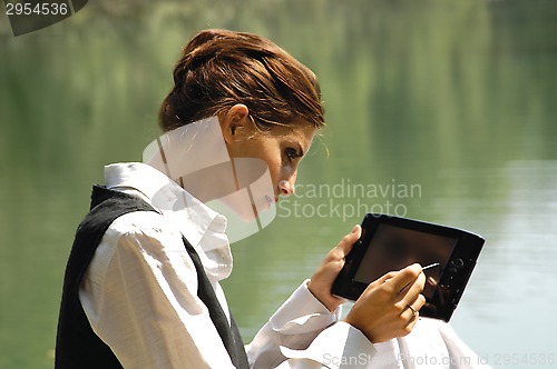 Image of beautiful slender girl with laptop