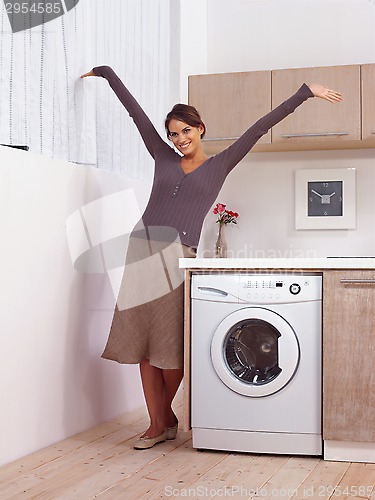 Image of woman near washing machine l