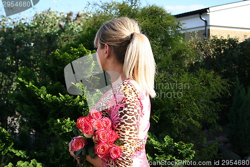 Image of Swedish woman and pink Roses