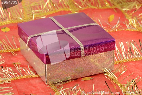 Image of red gift box with white ribbon bow