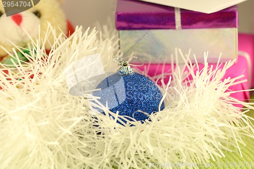 Image of Christmas red gift with blue ball, new year card