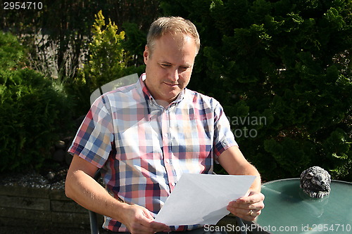 Image of Swedish man is reading letter